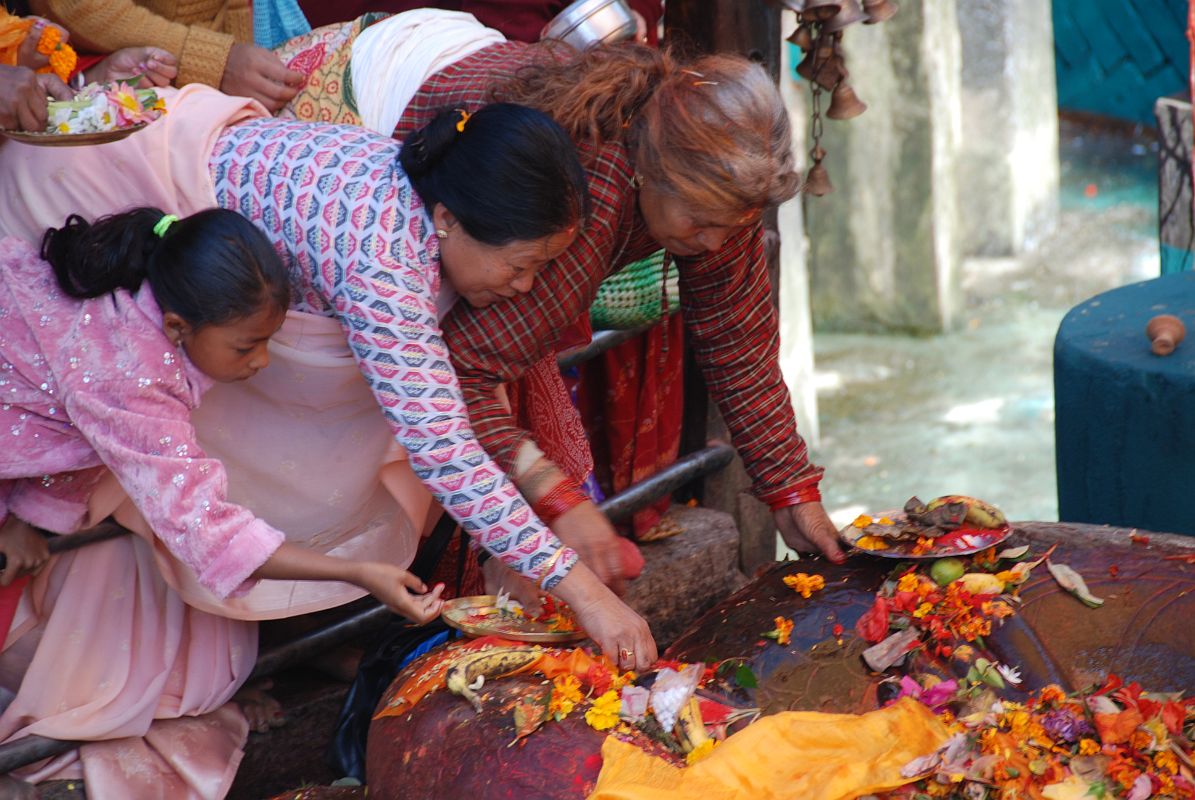 Kathmandu Valley 1 Budhanikantha 5 Pilgrims Making Offerings At Sleeping Vishnu The Hindu pilgrims are allowed to enter Budhanilkantha Narayan (Sleeping Vishnu) after the priests are finished and make offering and touch Vishnus feet.